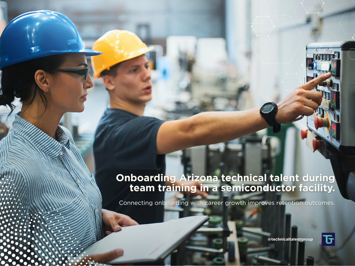 Two engineers conducting equipment training in a semiconductor facility, representing onboarding Arizona technical talent and workforce development.